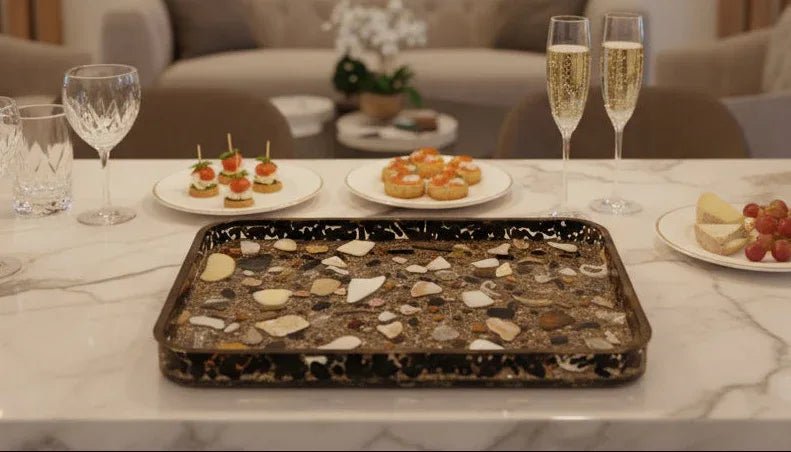 Resin serving tray with shells and sand backdrop, coastal centerpiece