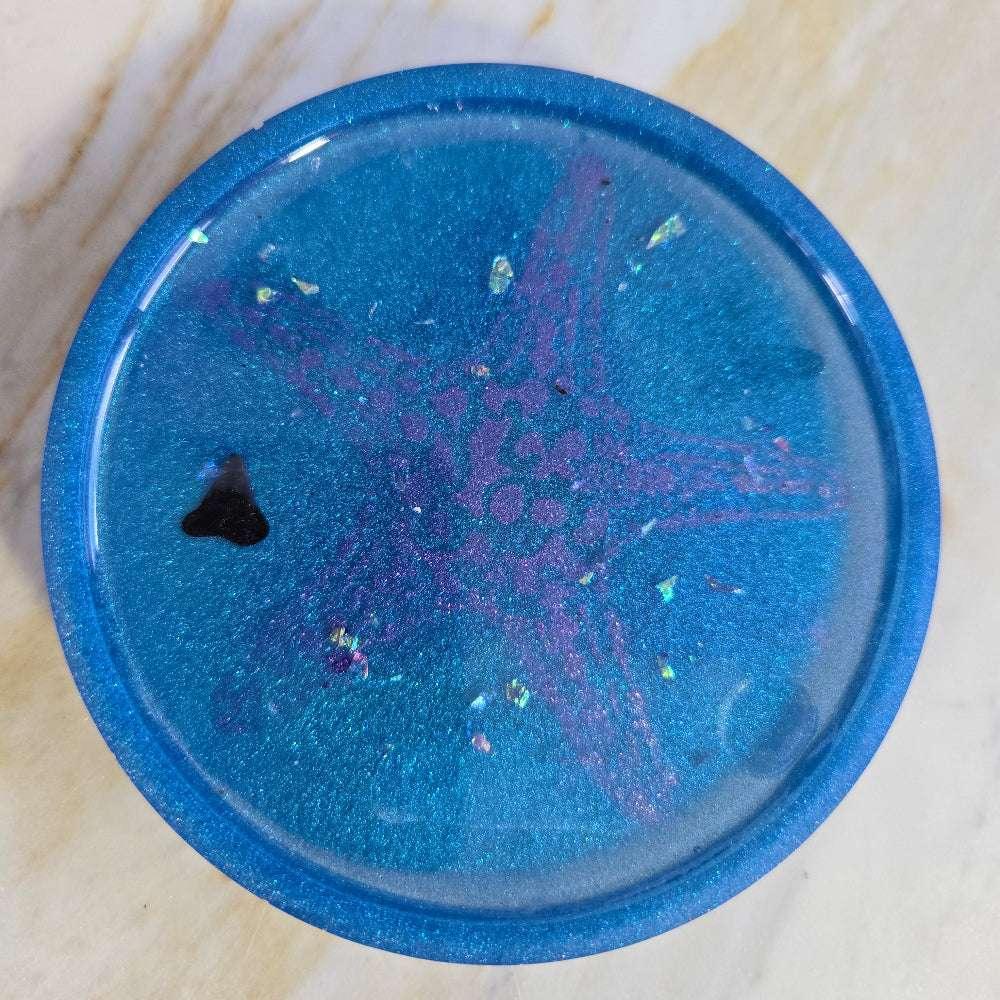 Resin coaster with tropical flower design, coastal paperweight