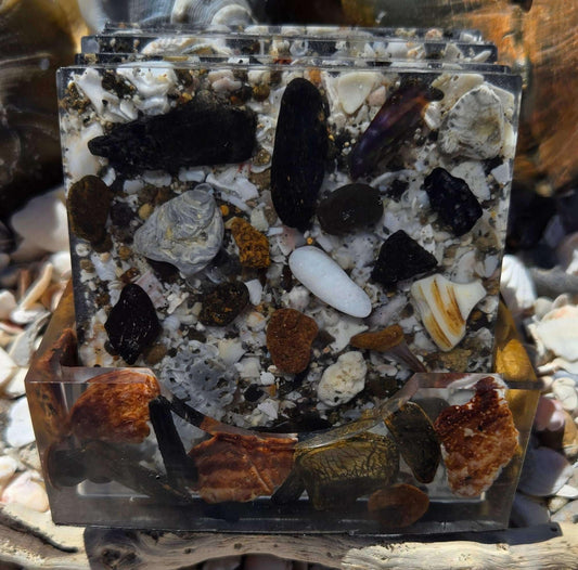 Set of resin coasters with beach treasures and sand textures
