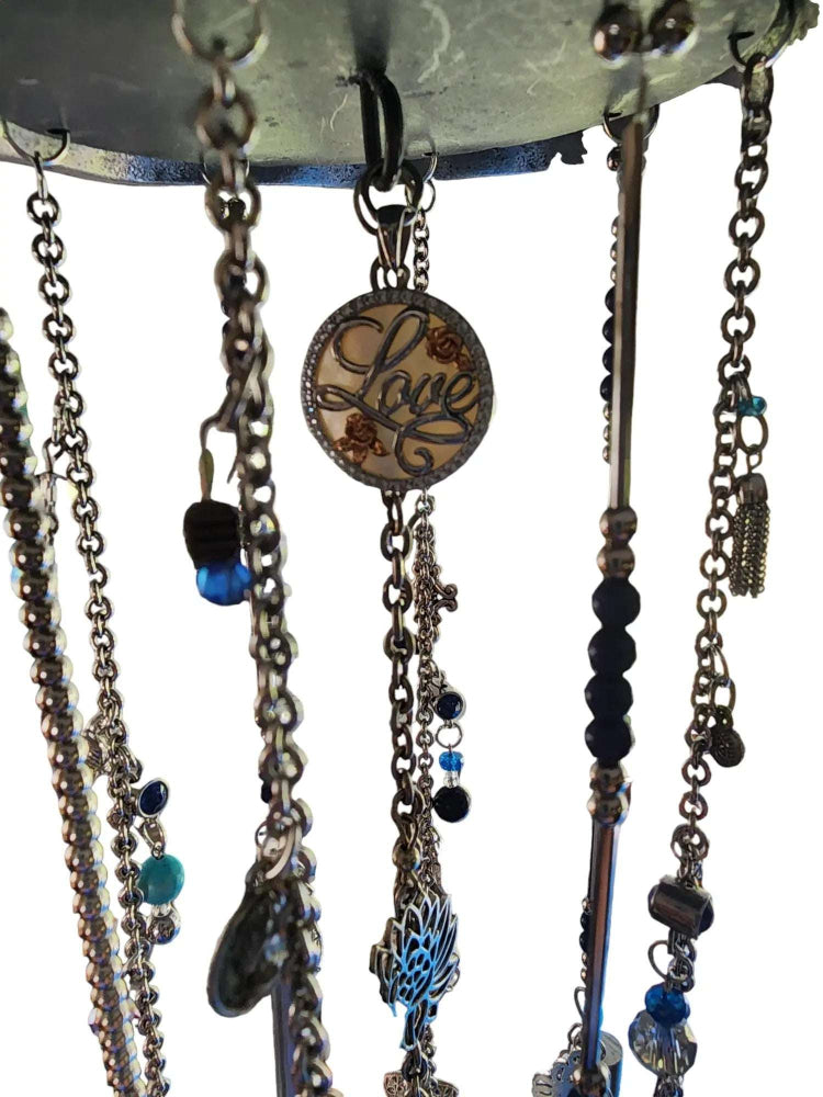 Silver and Blue windchime with a love charm in the center.
