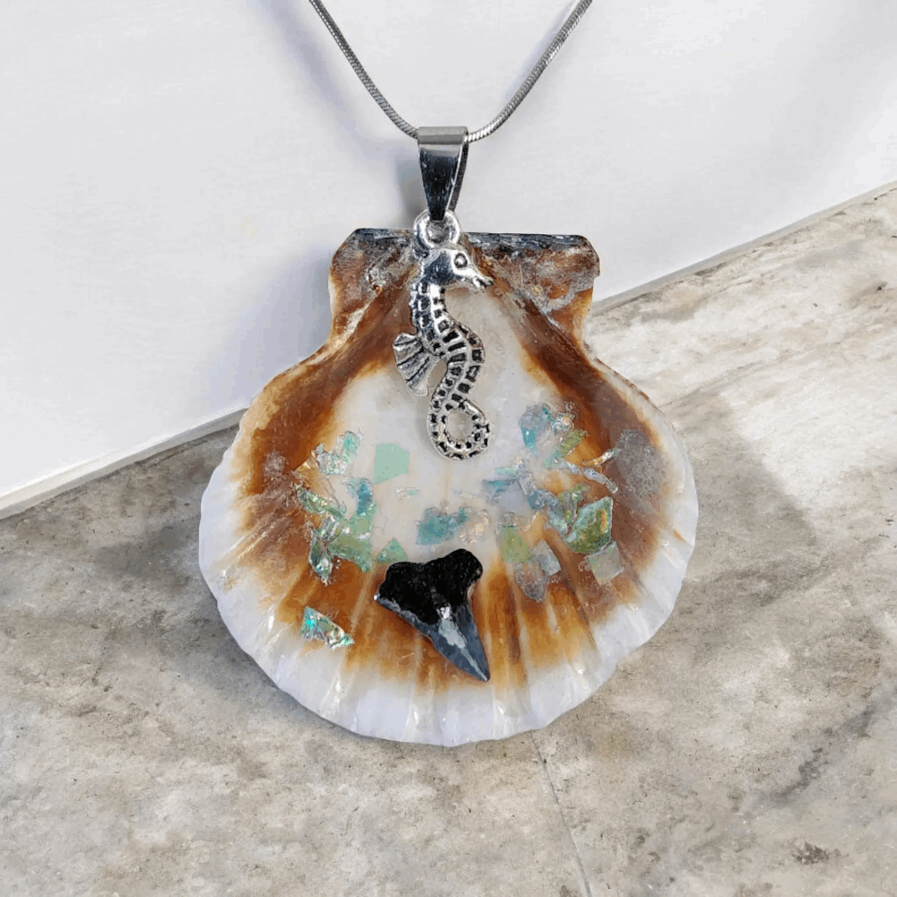 Seashell pendant with shark tooth, seahorse charm, and 10-inch chain, ocean inspired jewelry, handmade coastal accessory.