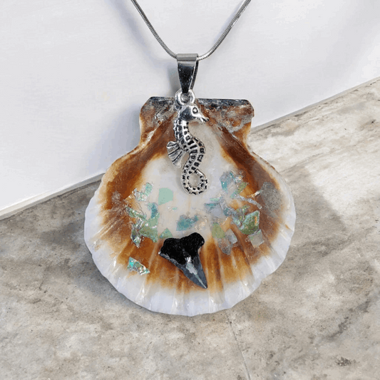 Seashell pendant with shark tooth, seahorse charm, and 10-inch chain, ocean inspired jewelry, handmade coastal accessory.