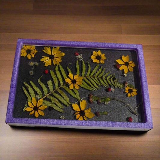 Yellow Flower Tray with purple rim and black back ground