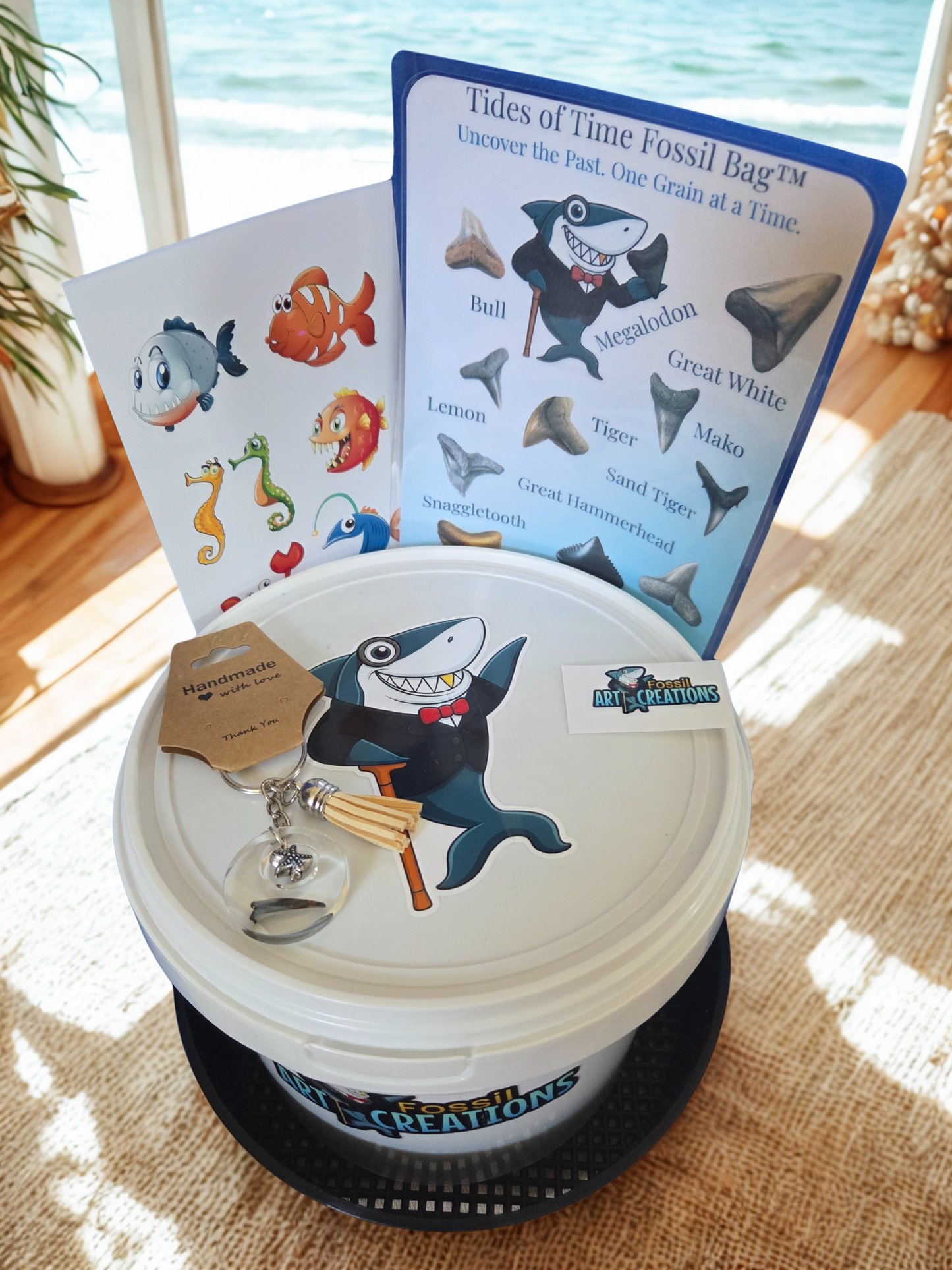 Shark-themed educational product with cards and a container on a wooden surface.