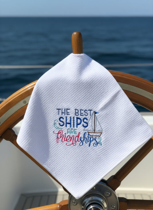 Embroidered towel with 'The best ships are friendship' text on a blue background