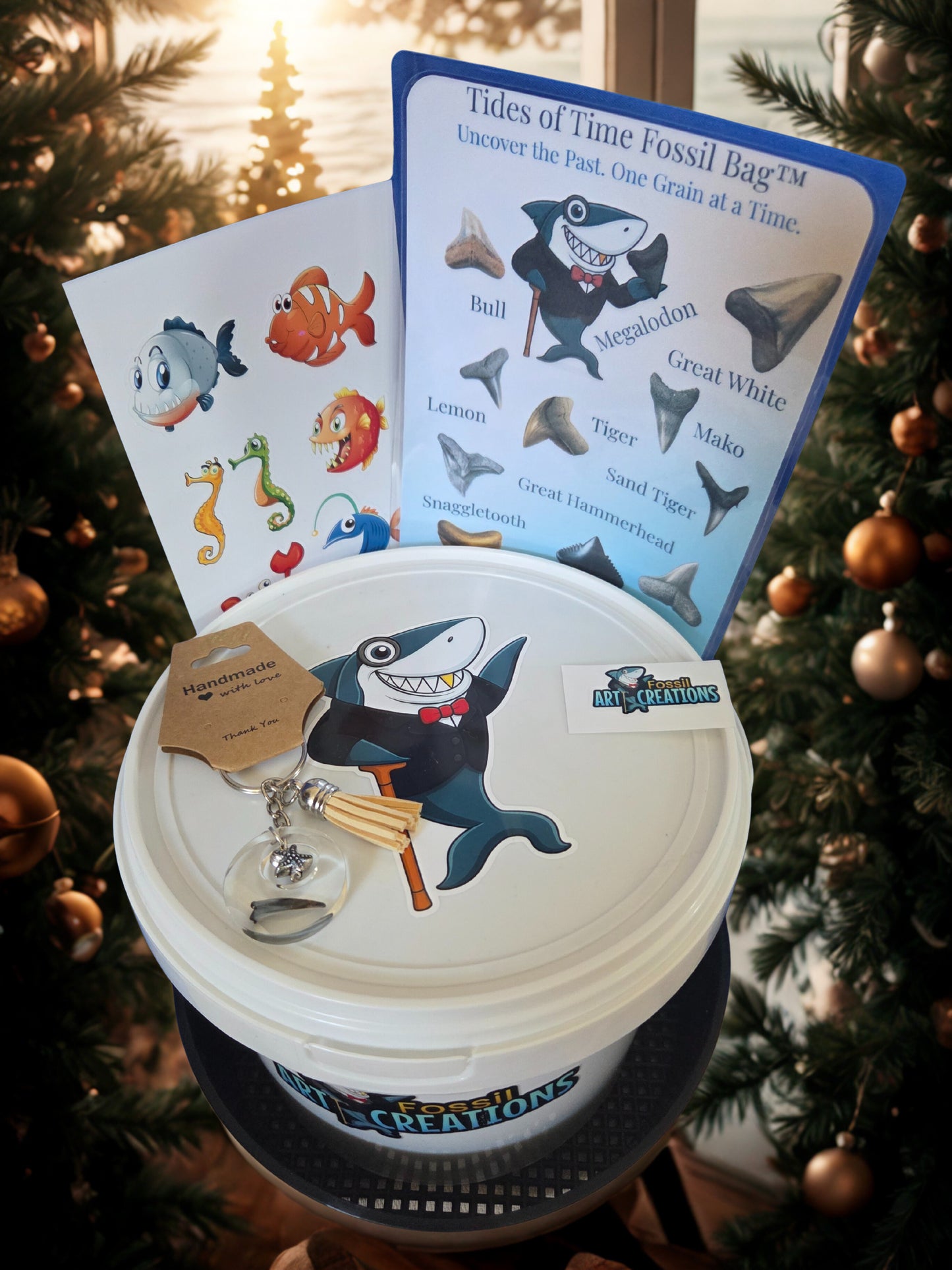 Shark-themed educational product with cards and a container on a Christmas tree background
